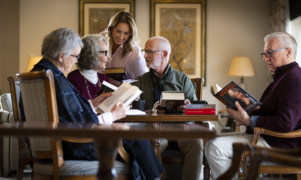 Prospect Hill Camberwell, retirement living - group reading around a table